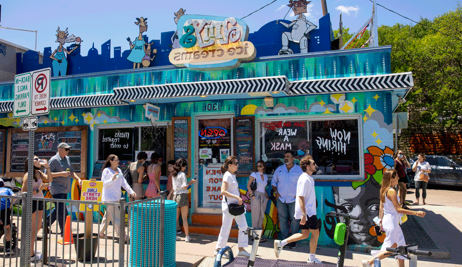 A crowd of people in front of Amy's Ice Cream